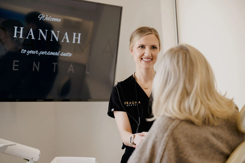 Dr. Brittany Hand Welcoming a Patient To Pragma Dental