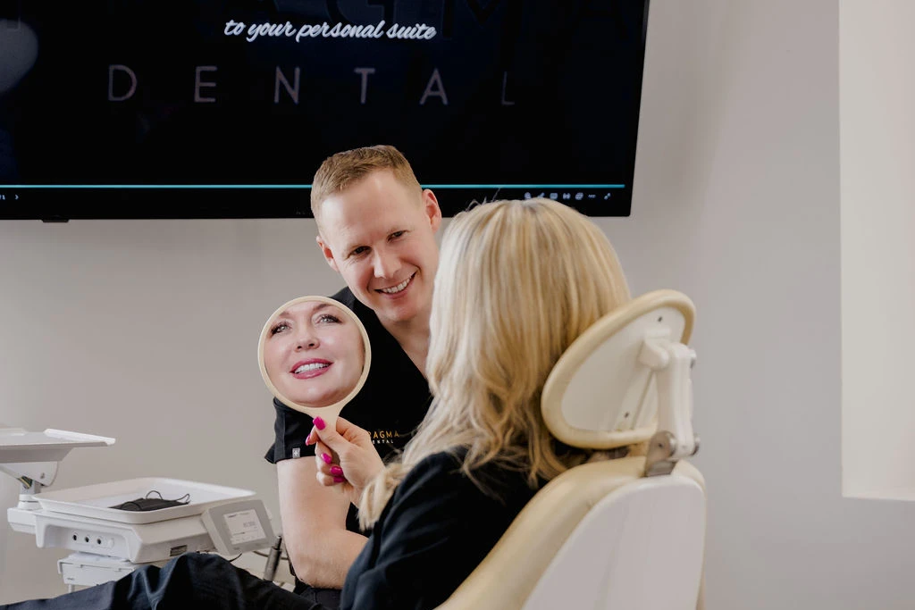 Dr. Gustafson With Smiling Patient After Cosmetic Dentistry Treatments