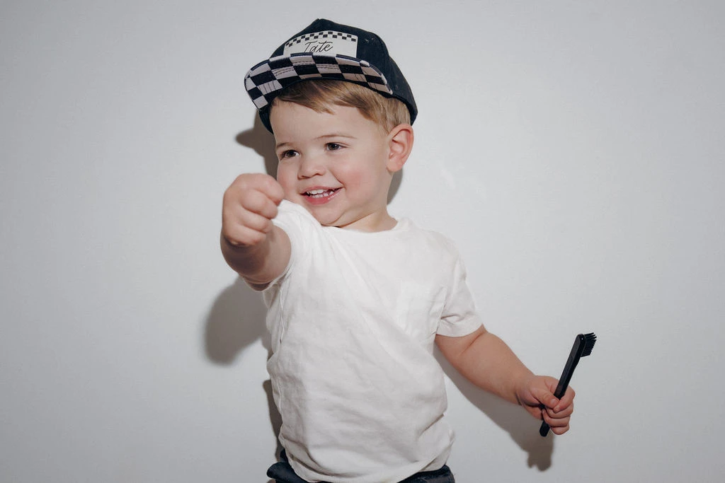 Pragma Dental Kid With Toothbrush in Hand